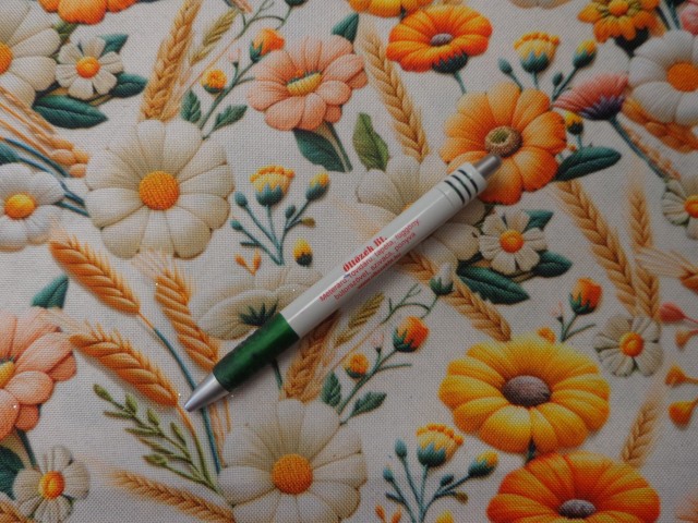 Vízlepergetős vászon, sárga-narancs virágos (15255)